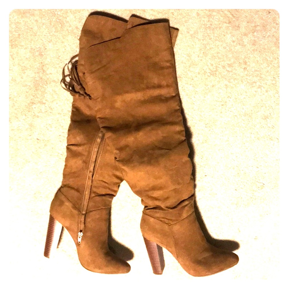 Knee high, high heeled boots.
